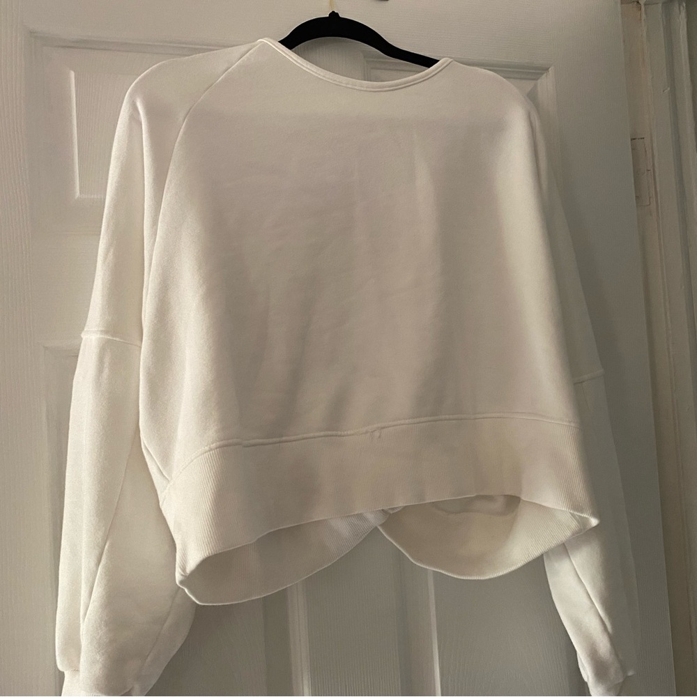 Lulus pullover sweater with knot on back .